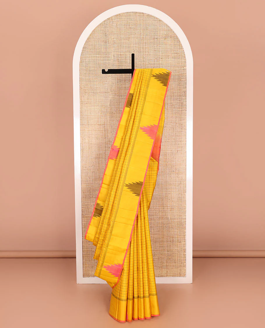 Yellow checked Kanchipuram silk saree, thazampoo rekku border, and pallu of pillaiyar mokku, and seppu rekku designs