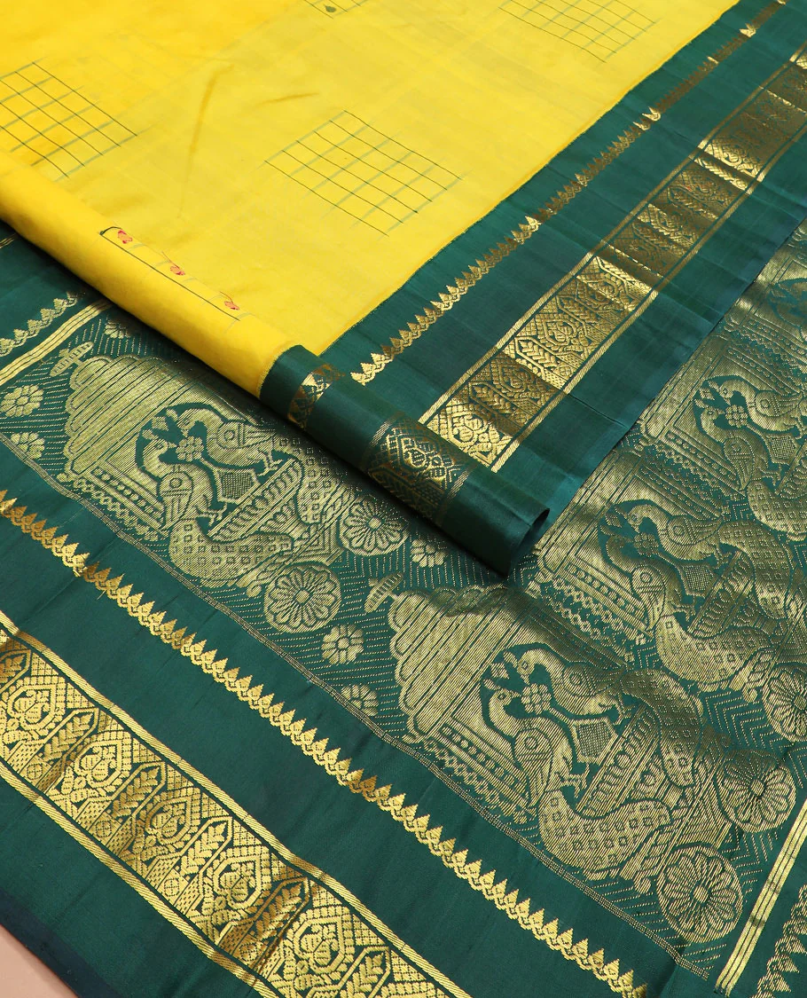Yellow daayam kattam inspired motifs Kanchipuram silk saree, contrast korvai rettai pettu border of thilakam mokku, and manga designs, and pallu of mayil chariot designs - Image 2
