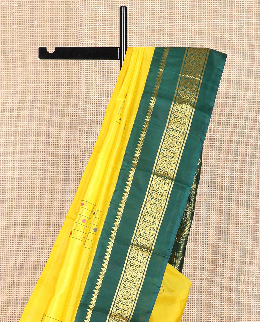 Yellow daayam kattam inspired motifs Kanchipuram silk saree, contrast korvai rettai pettu border of thilakam mokku, and manga designs, and pallu of mayil chariot designs - Image 3