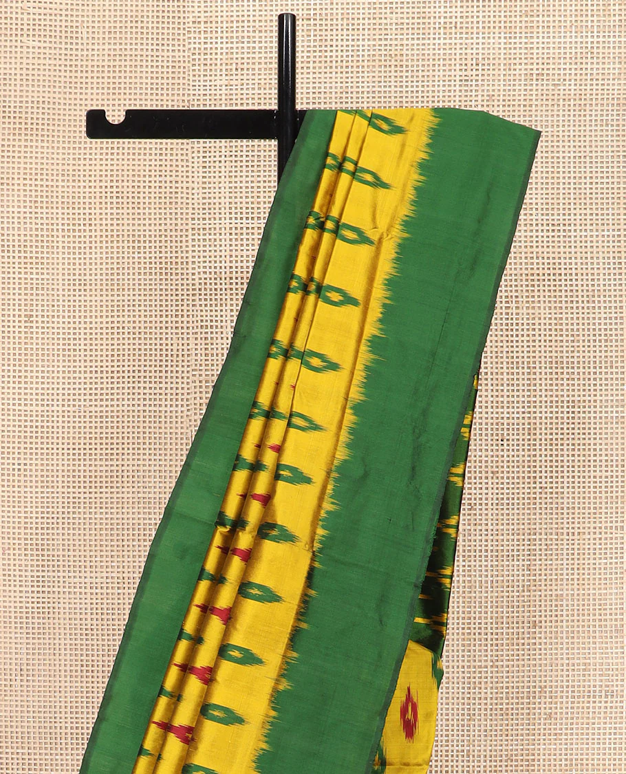 Yellow Ikkat Silk Saree Ornamented with Ikkat Buttas, Featuring a Contrast Plain Border, Complemented by a Pallu Ikkat Woven in an Ogee Pattern - Image 3