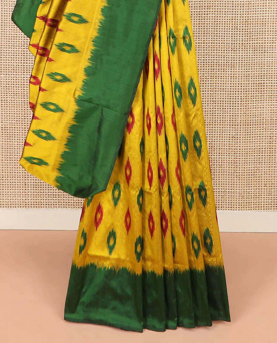 Yellow Ikkat Silk Saree Ornamented with Ikkat Buttas, Featuring a Contrast Plain Border, Complemented by a Pallu Ikkat Woven in an Ogee Pattern - Image 4