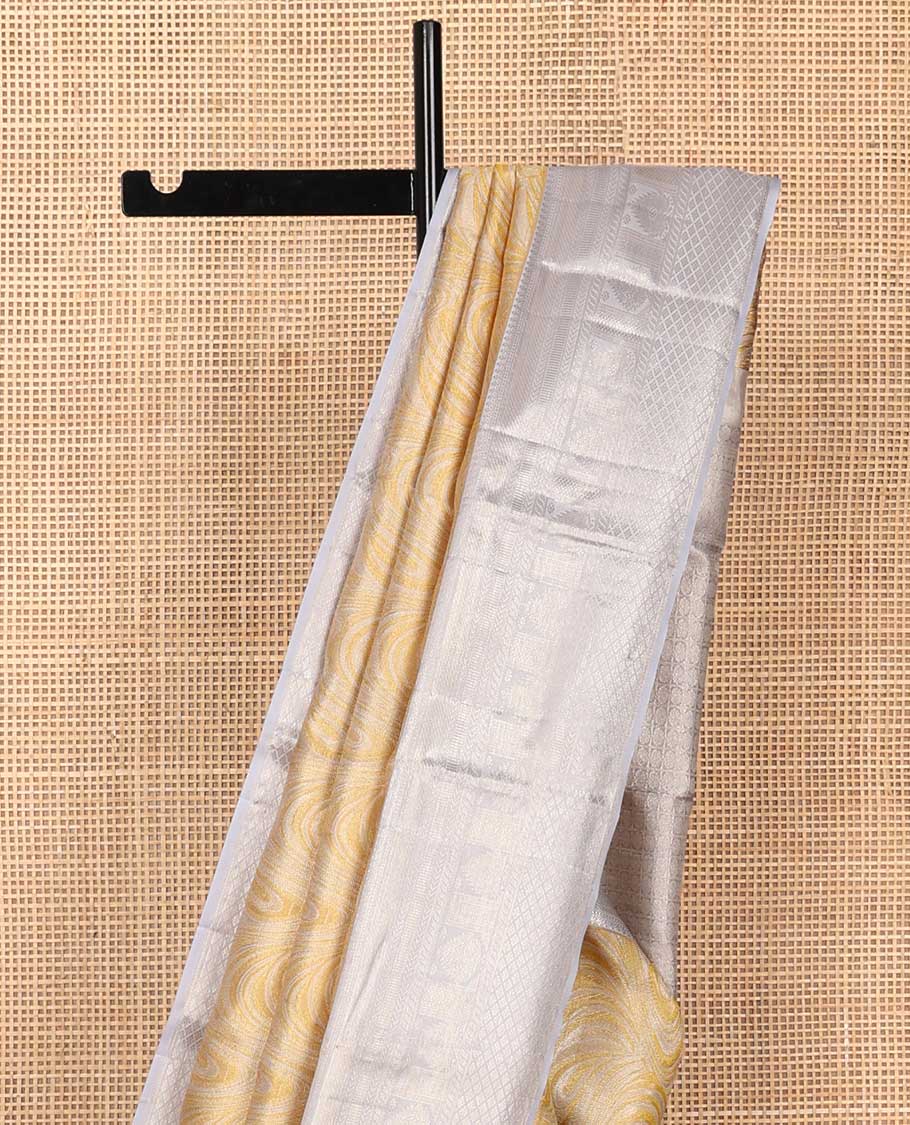 Yellow jacquard Kanchipuram tissue silk saree, contrast border of thilakam mokku, muthu, kathir, puli nagam, and jaal designs, and butta enclosed checks - Image 5