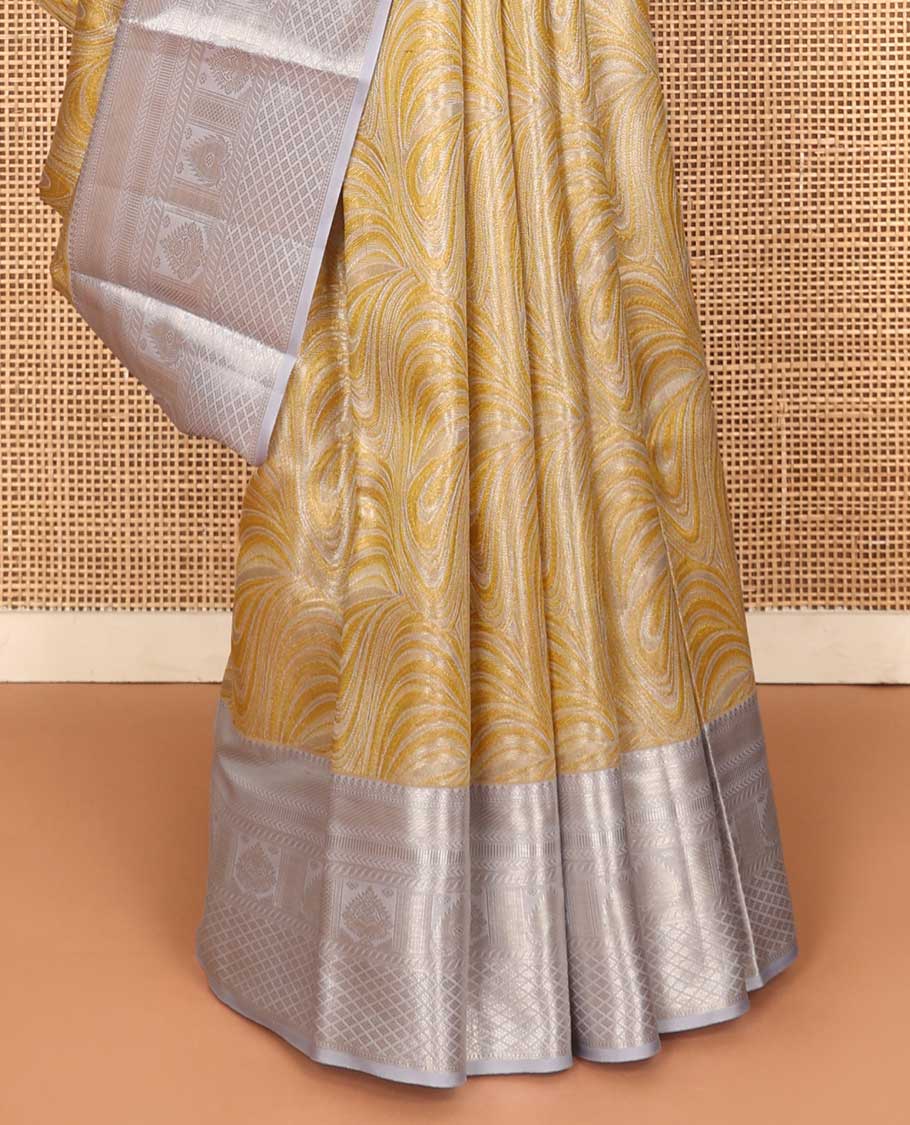 Yellow jacquard Kanchipuram tissue silk saree, contrast border of thilakam mokku, muthu, kathir, puli nagam, and jaal designs, and butta enclosed checks - Image 6
