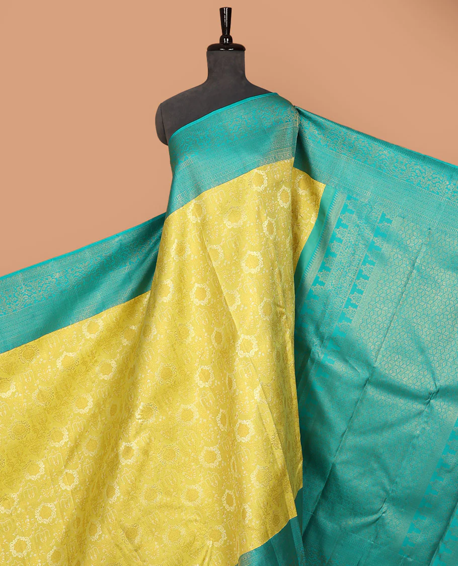 Yellow jacquard Samudrika silk saree, contrast geometric patterned zari border & argyle patterned pallu