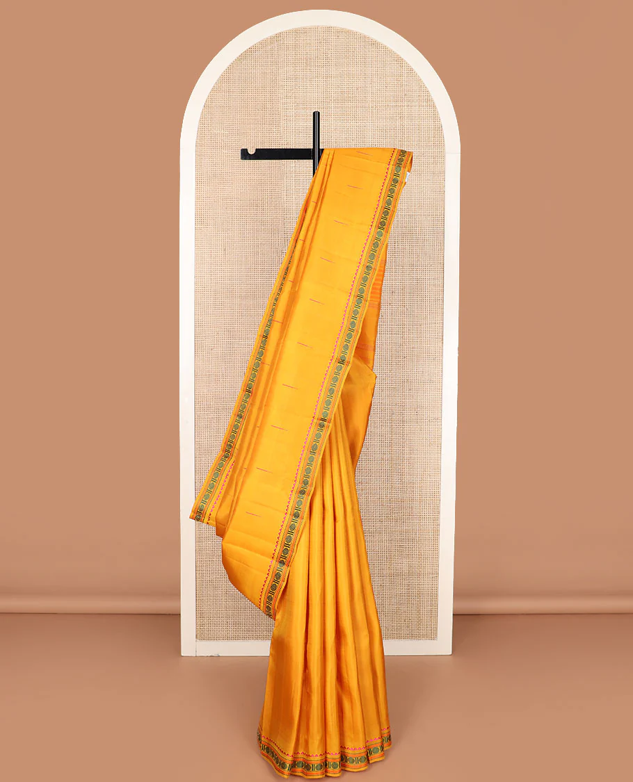 Yellow malli mokku buttas Kanchipuram silk saree, self-border of rekku, muthu, kathir, and rudraksham motifs, and  seppu rekku pallu