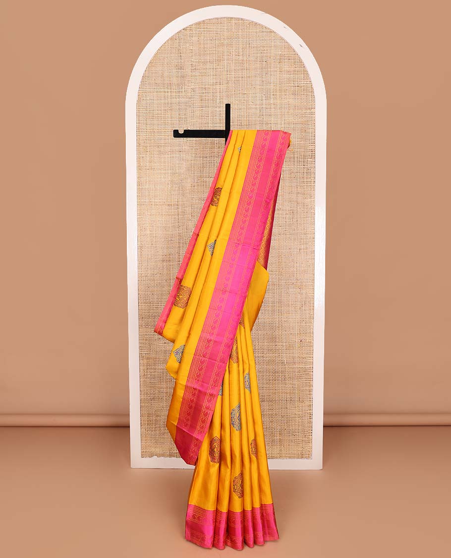 Yellow mayil buttas Kanchipuram silk saree, contrast border of thilakam, muthu, neli, and manga designs, and jaal pallu