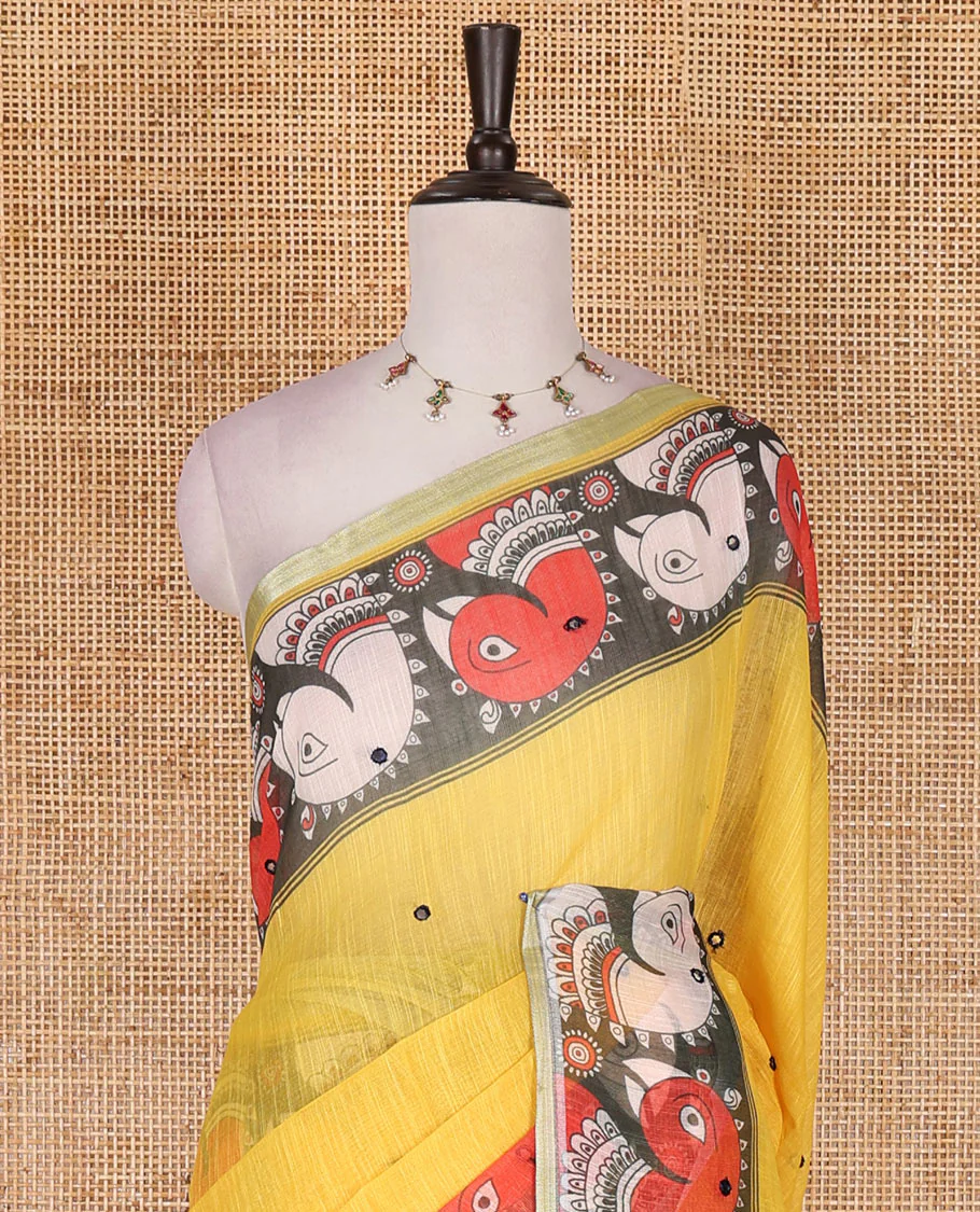 Yellow mirror thread embroidered linen saree, contrast kalamkari peacock printed border, pallu of kalamkari peacock and human figurines print, and printed blouse - Image 3