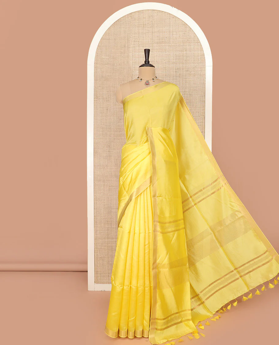 Yellow Plain Banana Pith Saree Subtly Sparkled with Zari Bavanji Border, Gleaming Zari Stripes Woven Pallu, and Paired with a Matching Plain Blouse