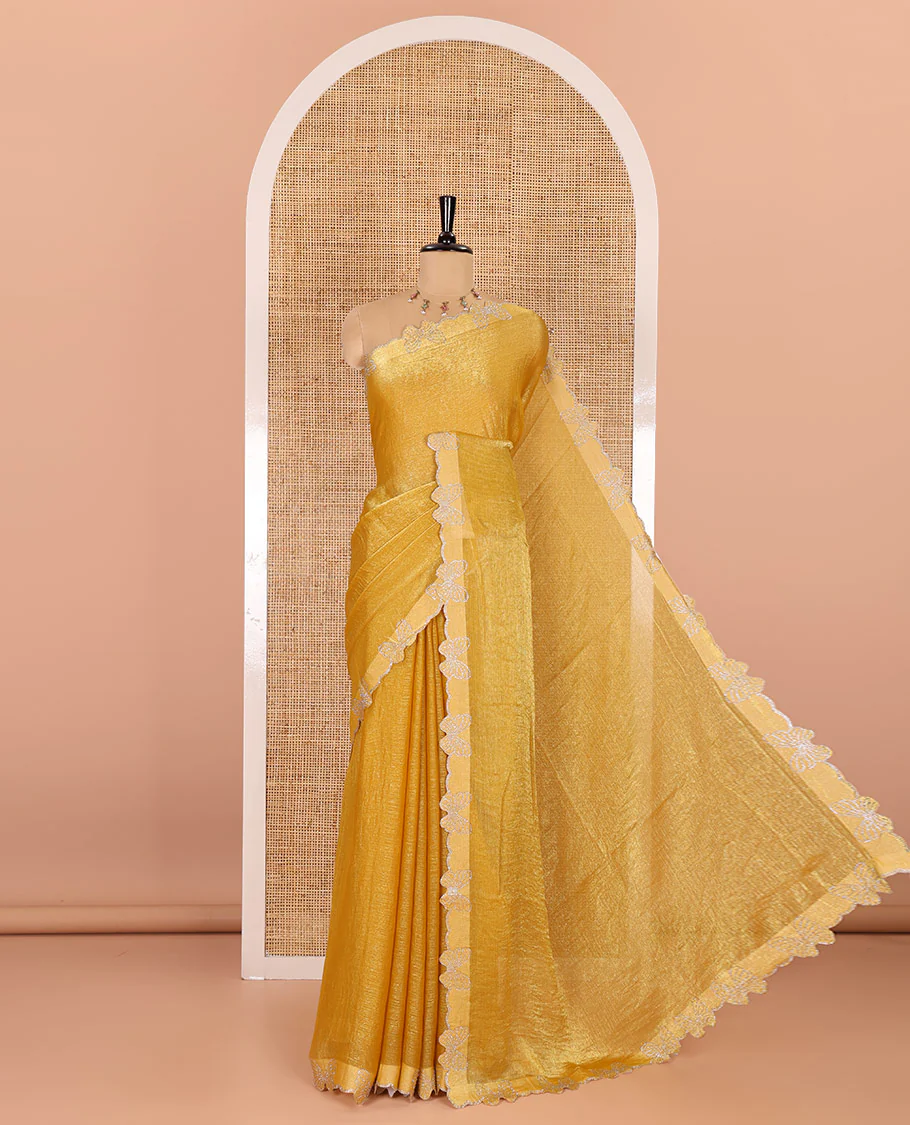 Yellow plain fendy chiffon saree, scallop border of butterfly motifs in stone work, self-pallu, and a matching blouse
