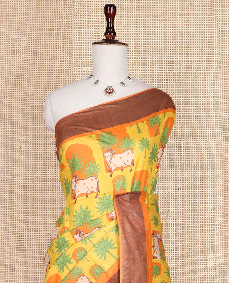 Yellow tree and Pichwai cow printed tussar silk saree, bavanji border, and checked pallu - Image 2