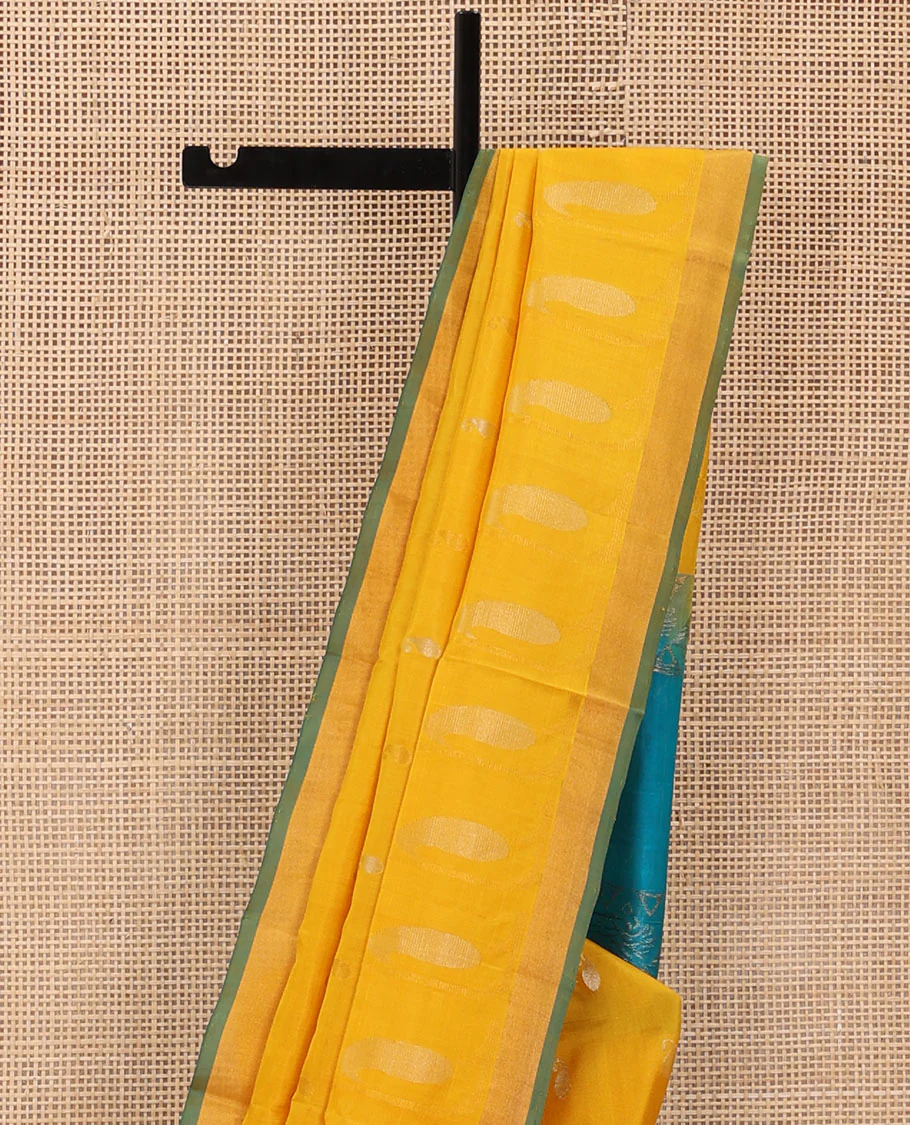 Yellow Uppada Silk Saree Gracefully Embellished with Zari Buttas and Paisley Buttas, Subtle Bavanji Border, Complemented by Contrast Pallu of Peacock Designs, and Paired with a Contrast Blouse - Image 3