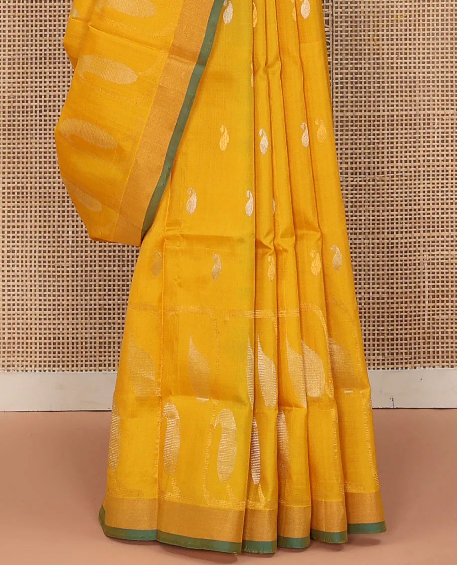 Yellow Uppada Silk Saree Gracefully Embellished with Zari Buttas and Paisley Buttas, Subtle Bavanji Border, Complemented by Contrast Pallu of Peacock Designs, and Paired with a Contrast Blouse - Image 4