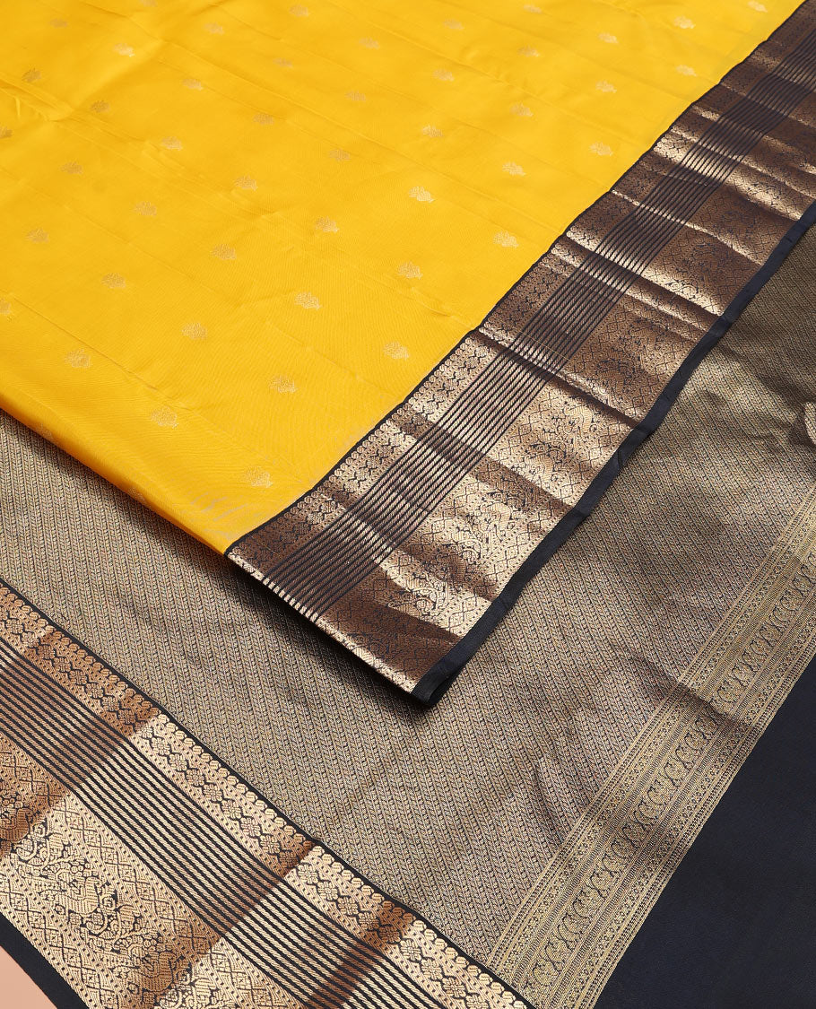 Yellow Vasundhara Lite-Silk Mix Saree Decked Up with Zari Buttas, Complemented by a Contrast Black Border Depicting Manga, Muthu, Kamalam, Banaras, Diamond, and Mayil Designs, Pallu Steeped with Diagonal Leaf Vines, and a Contrast Blouse - Image 2