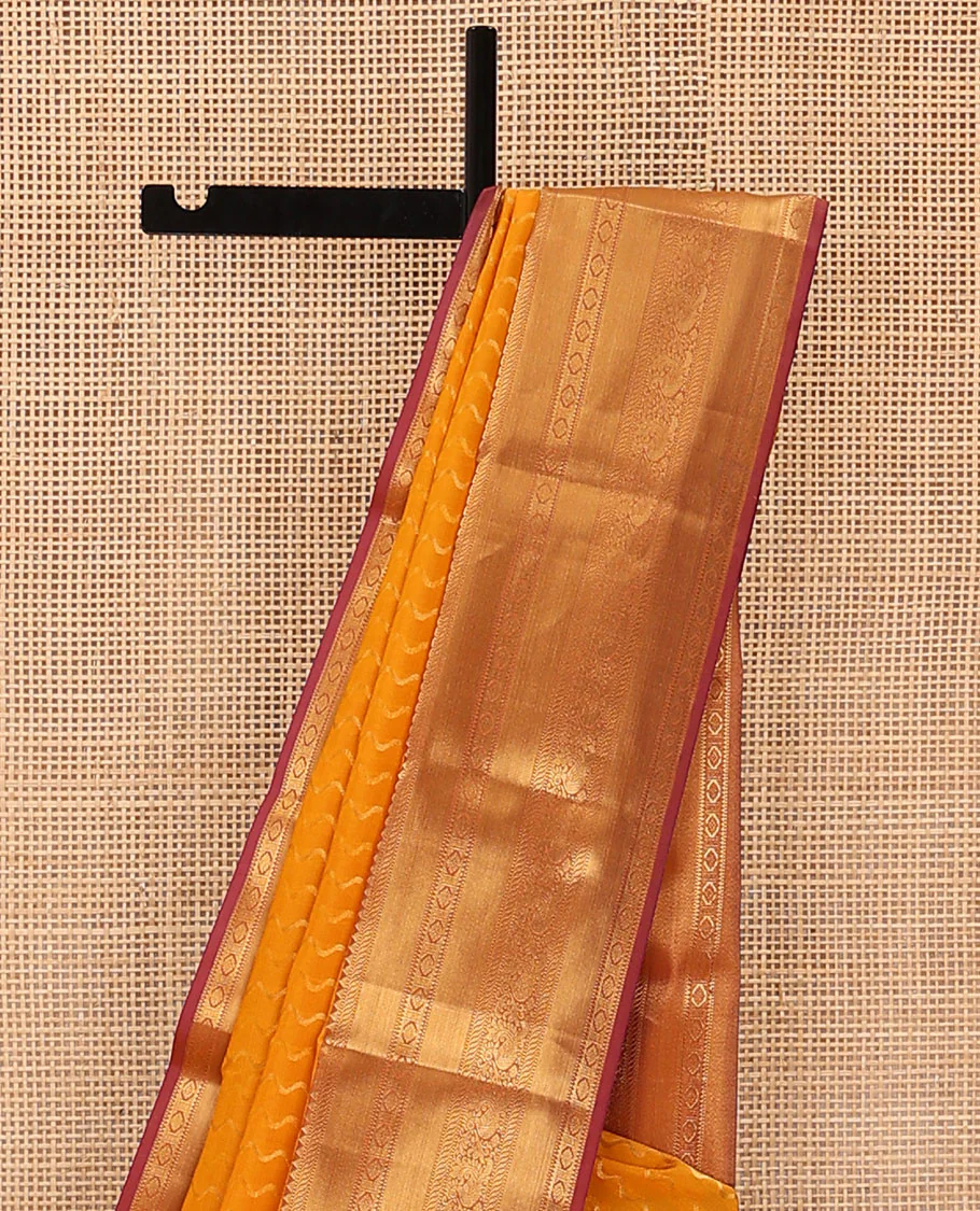 Yellow Vasundhara Lite Silk Mix Saree Highlighted by Zig-Zag Stripes, Featuring a Contrast Border of Rekku, Muthu, Puli Nagam, Laddu Kamalam, and Mayil Designs, Pallu Steeped with Traditional Zari Designs, and a Contrast Blouse - Image 3