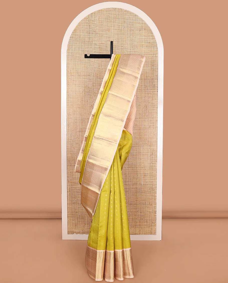 Yellow zari buttas and micro-checked Vasundhara Lite Silk Mix Saree, contrast border of thilakam mokku, banaras, paisa, mayil, banaras, and zari design, and peacock feather motifs pallu