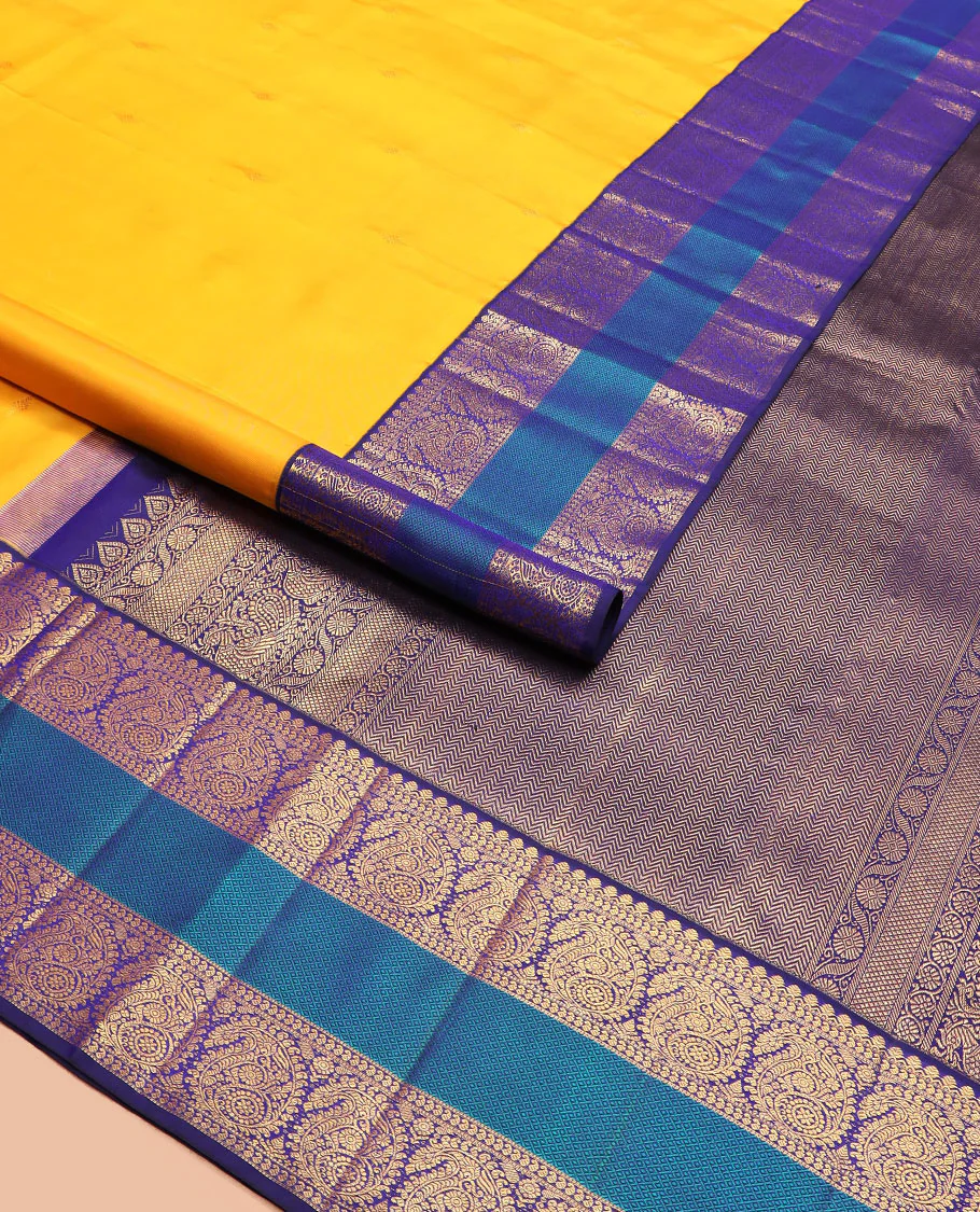 Yellow zari buttas Kanchipuram silk saree, contrast border of salangai, manga, muthu, arumbu manga, and mayil kann designs, and vanki pallu - Image 2