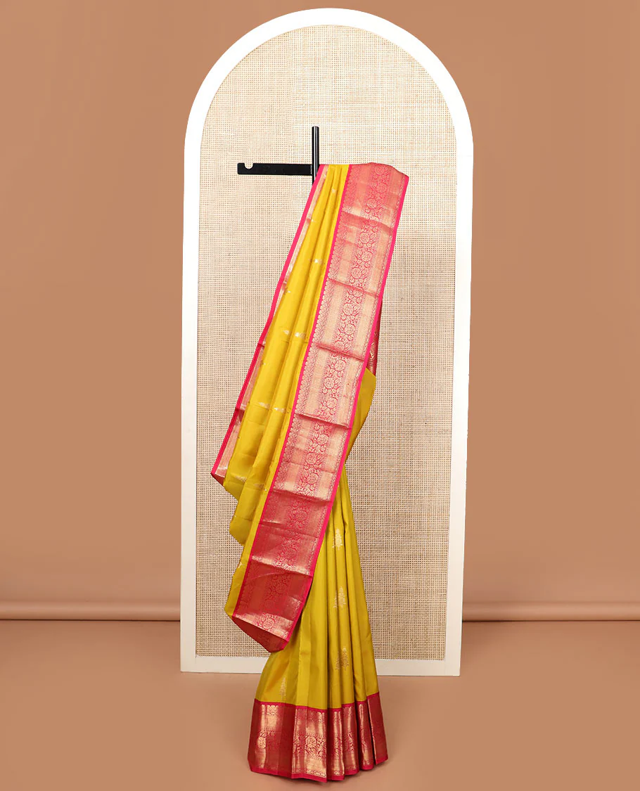 Yellow zari buttas Vasundhara silk saree, contrast border of mayil kann, and kodi visiry designs, and pallu of floral designs