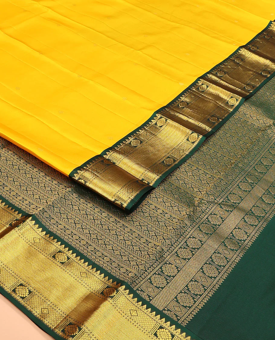 Yellow zari buttas Vasundhara silk saree, contrast border of rekku, chakram, diamond, and mayil kann designs, and geometric patterned pallu - Image 2