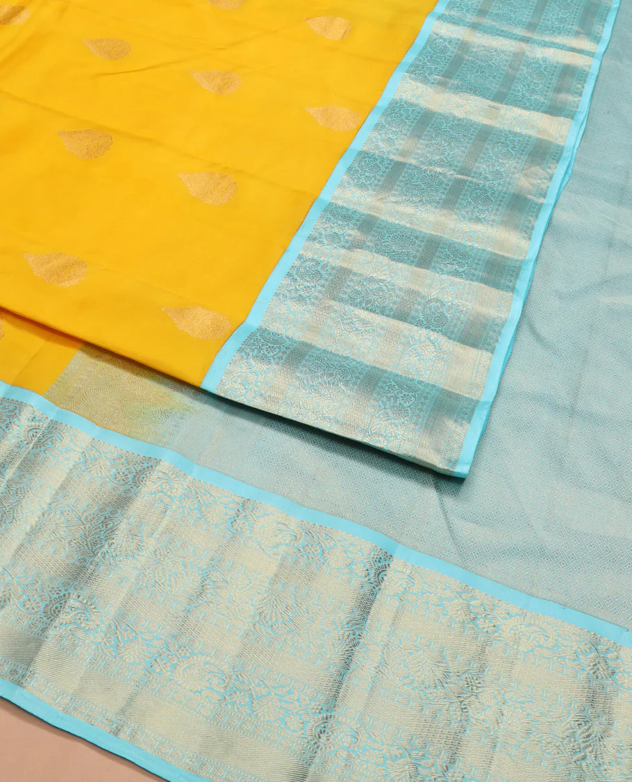 Yellow zari buttas Vasundhara silk saree, contrast border of rekku, muthu, kodi manga, kodi visiry, mayil kann, and rudraksham designs, and jaal pallu