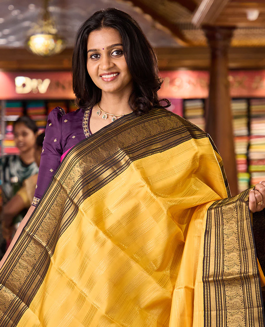 Yellow zari striped Kanchipuram silksaree, contrast border of kathir, and mayil designs, and pallu of mayil kann designs - Image 2